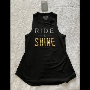 Peloton thrasher/distressed Ride & Shine women’s tank. NEW w tags.